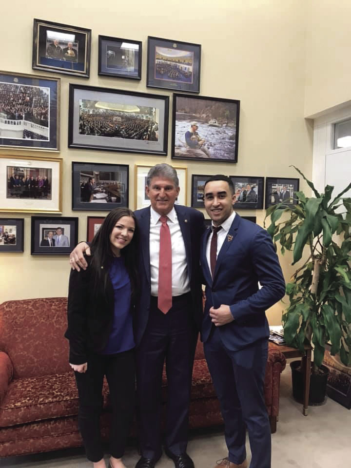 SGA Vice President Abbi Yachini and President Isaac Obioma pose with Sen. Joe Manchin.